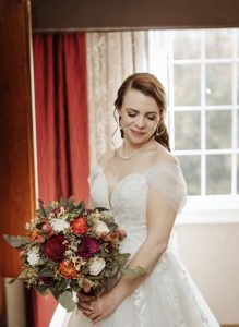 bride and her wood flower bouquet